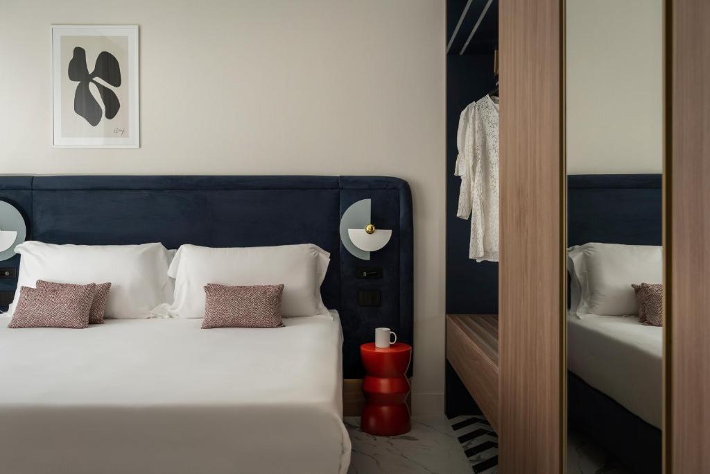 Postel nebo postele na pokoji v ubytování Parioli Hotel Rimini