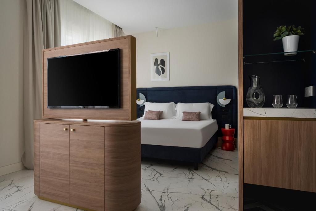 Postel nebo postele na pokoji v ubytování Parioli Hotel Rimini