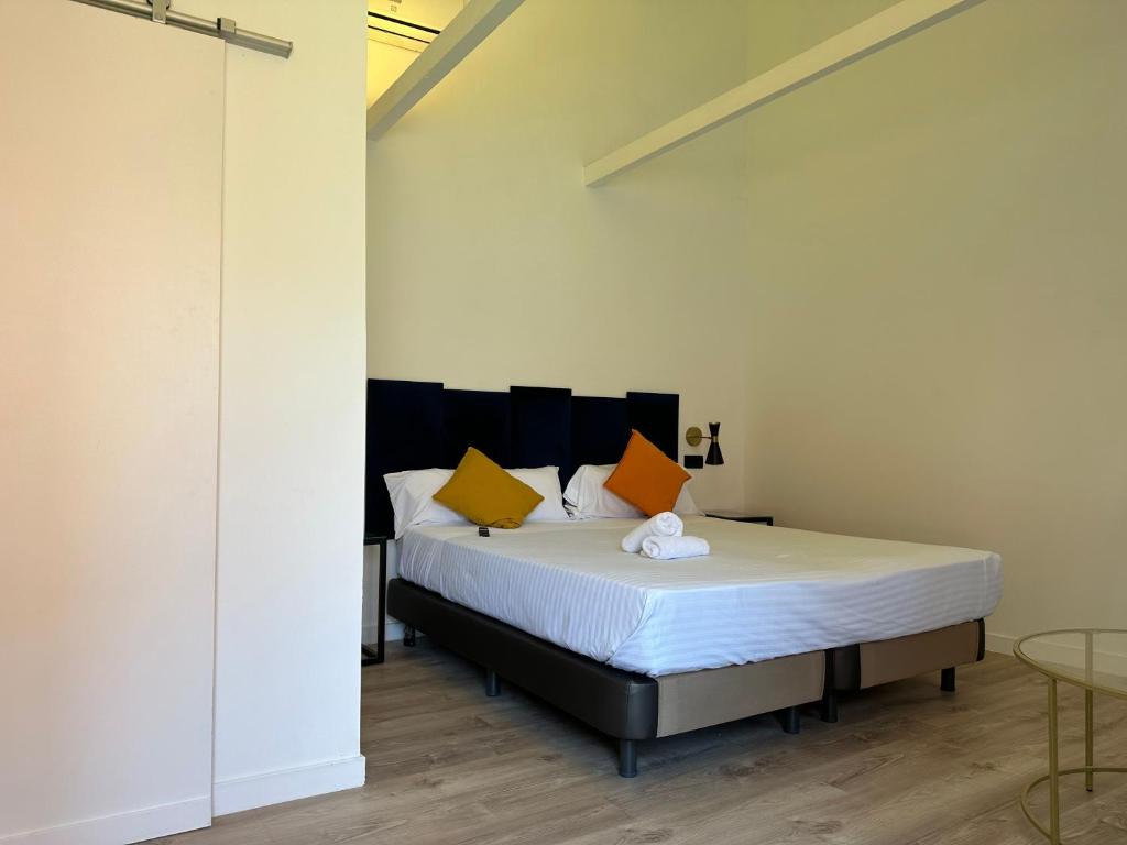 Posteľ alebo postele v izbe v ubytovaní Malaga City Suites
