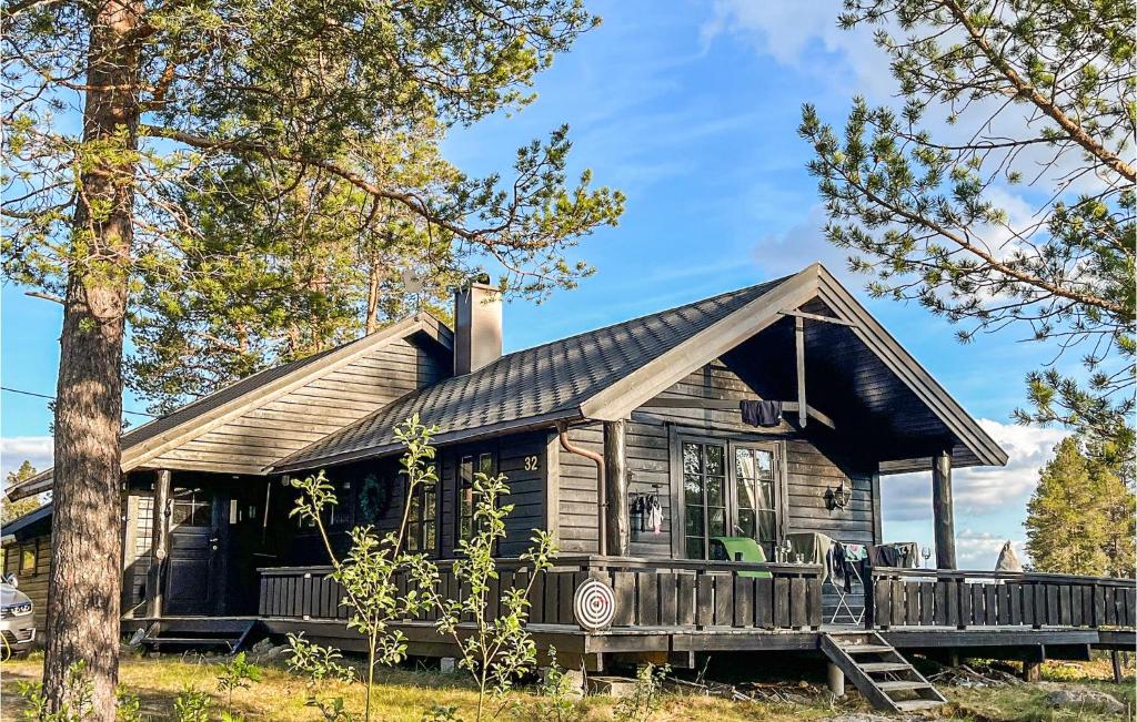 a large wooden house with a porch at Cozy Home In Bykle With Kitchen in Bykle