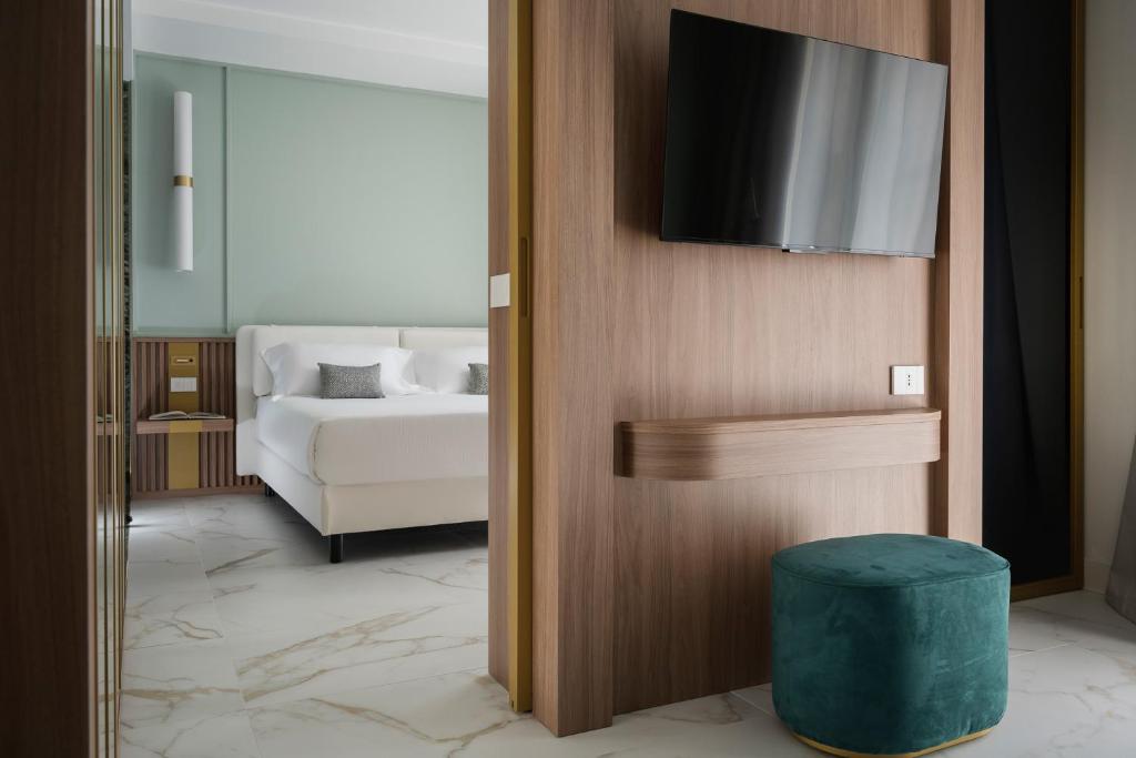 Postel nebo postele na pokoji v ubytování Parioli Hotel Rimini
