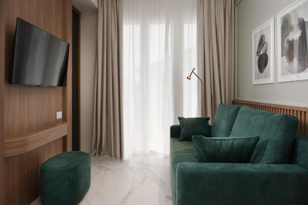 TV a/nebo společenská místnost v ubytování Parioli Hotel Rimini