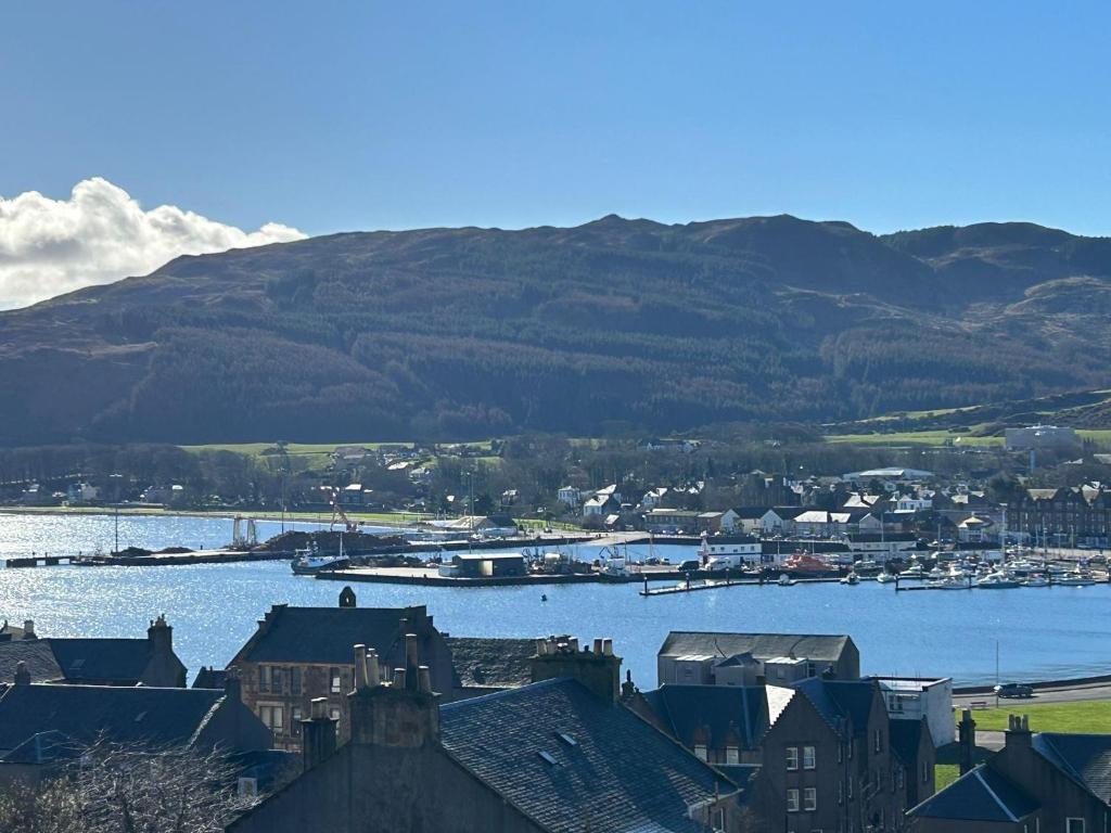 a view of a town with a river and houses at Campbeltown View in Campbeltown