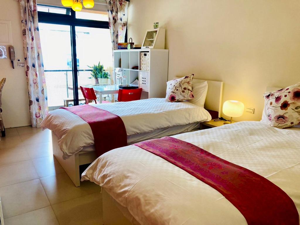 Postel nebo postele na pokoji v ubytování 心適都蘭Comfy Inn, Dulan