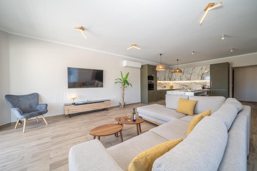 TV a/nebo společenská místnost v ubytování Maria Seaside Apartment