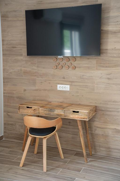 TV a/nebo společenská místnost v ubytování Maria Seaside Apartment