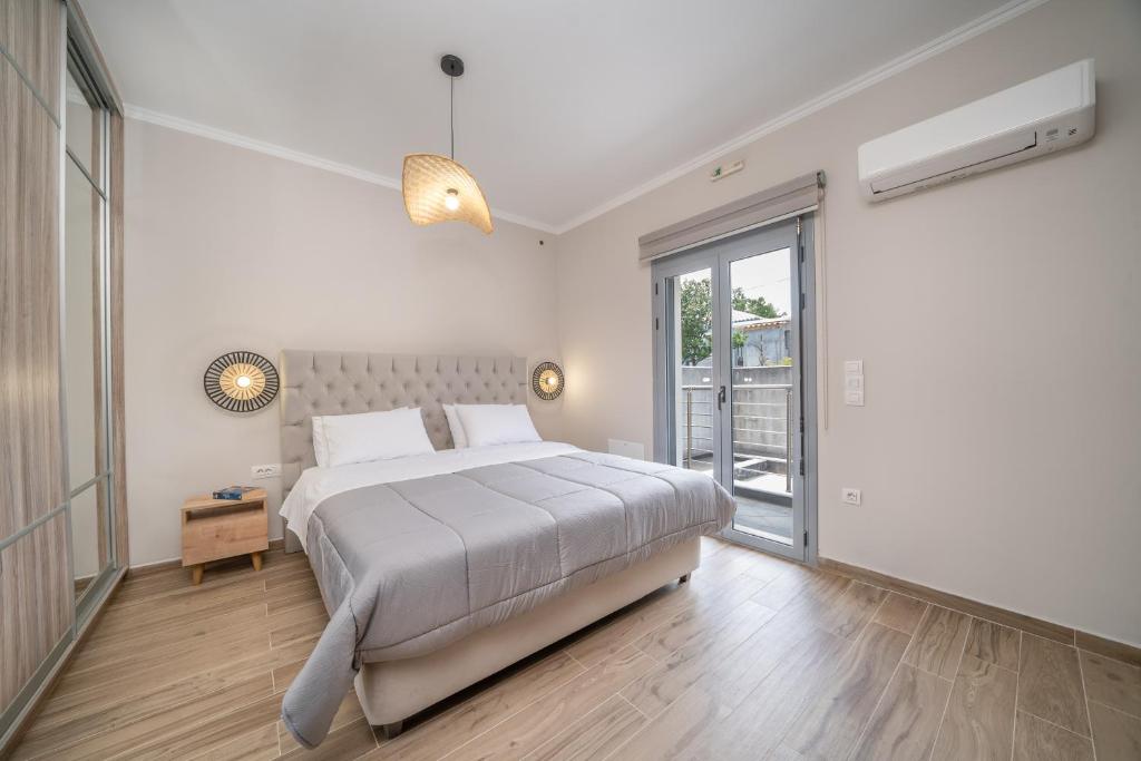 Postel nebo postele na pokoji v ubytování Maria Seaside Apartment