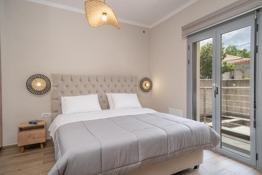 Postel nebo postele na pokoji v ubytování Maria Seaside Apartment
