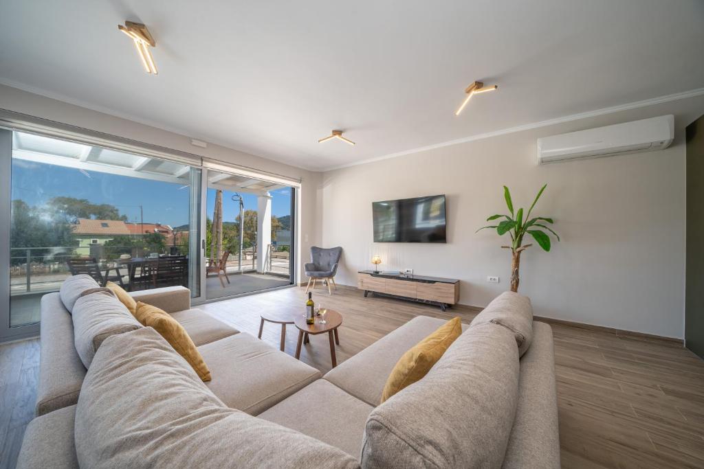 TV a/nebo společenská místnost v ubytování Maria Seaside Apartment