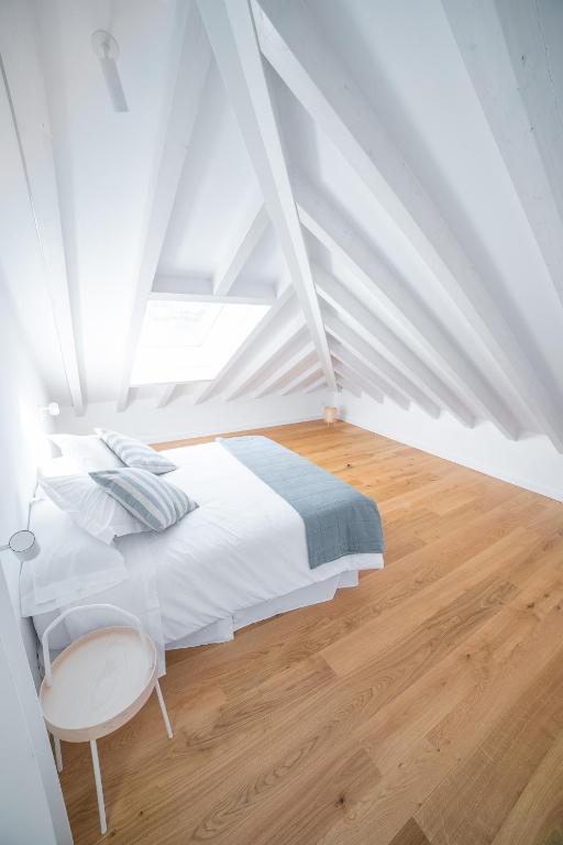 Posteľ alebo postele v izbe v ubytovaní Apartamentos Boutique Aroca