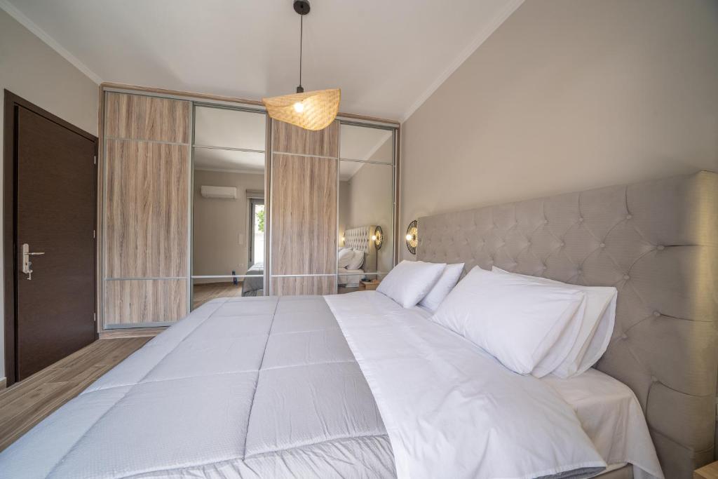 Postel nebo postele na pokoji v ubytování Maria Seaside Apartment