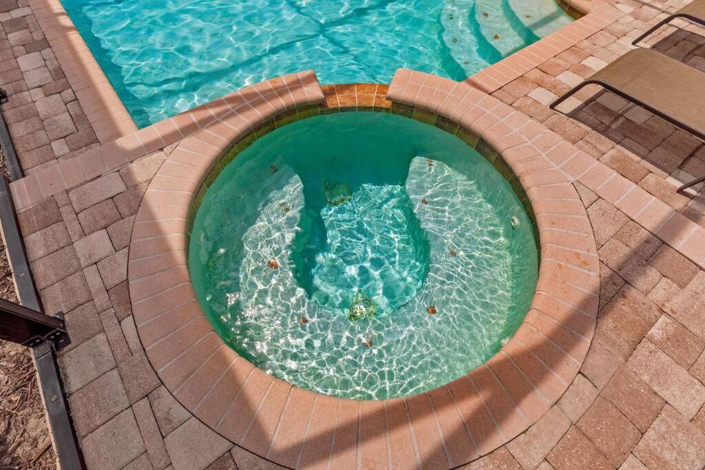an overhead view of a swimming pool at 535 -Villa Belvedere, A Stunning, Spacious 5 Bed Lake View Home with Pool and Spa in Davenport