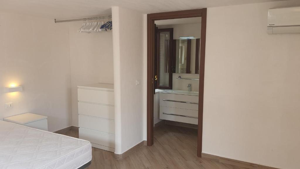 Letto o letti in una camera di Sotto la Torre e sopra il Porticciolo