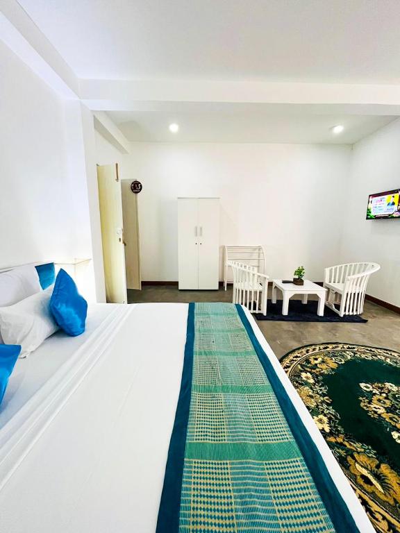 Katil atau katil-katil dalam bilik di Sunset Sands