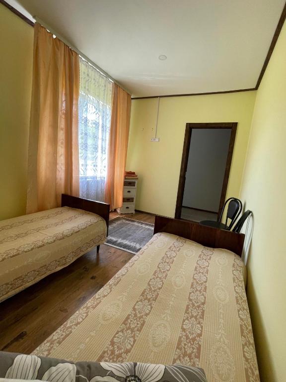 Postel nebo postele na pokoji v ubytování Садиба Карпат