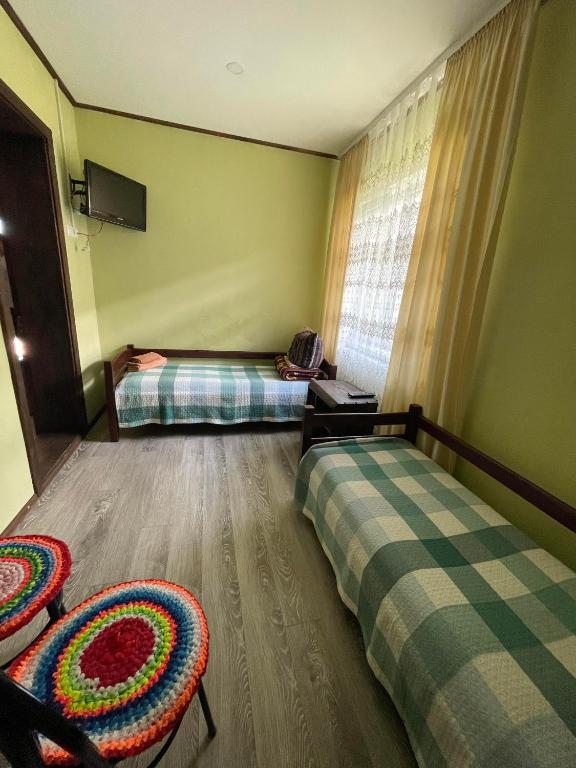 Postel nebo postele na pokoji v ubytování Садиба Карпат
