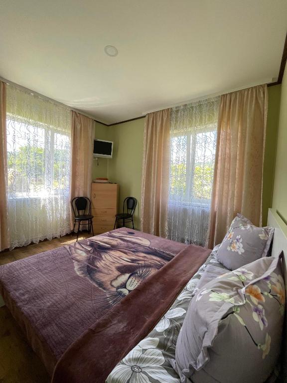 Postel nebo postele na pokoji v ubytování Садиба Карпат