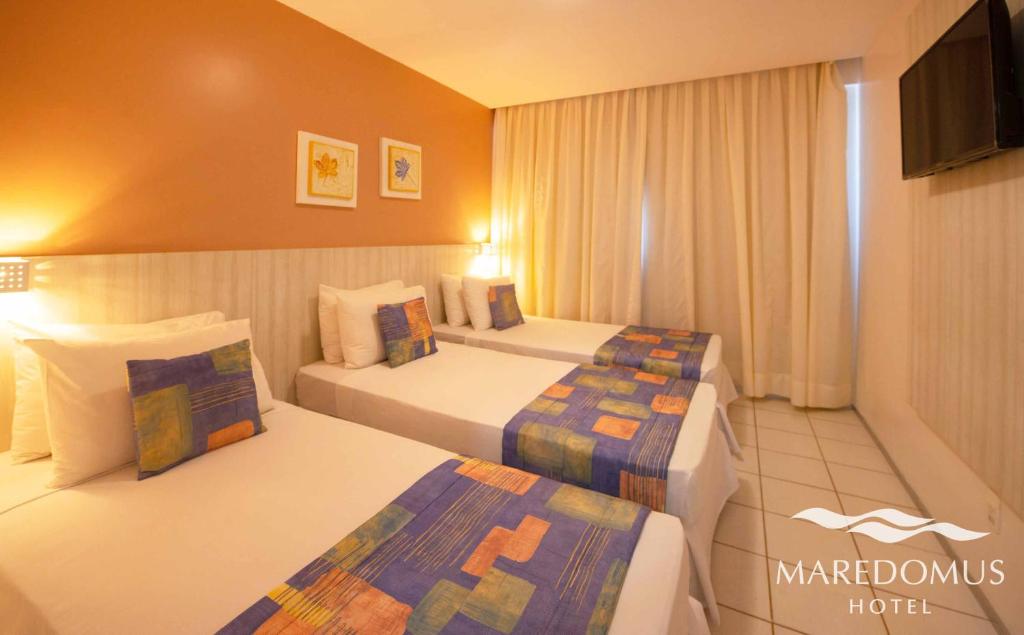 Cama ou camas em um quarto em Maredomus Hotel