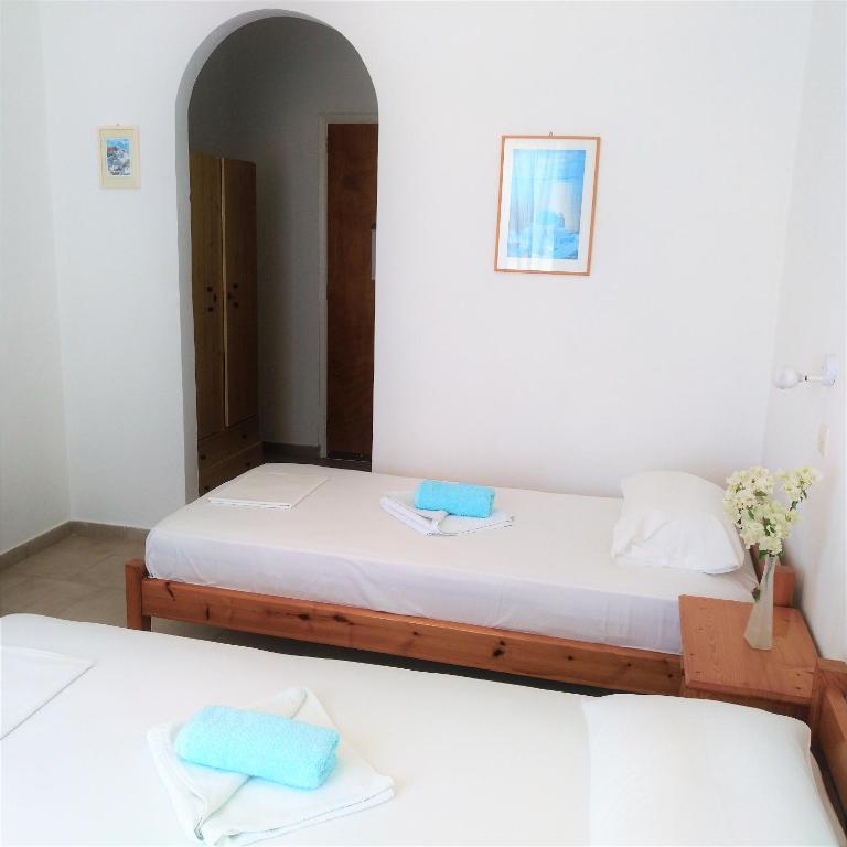 Postel nebo postele na pokoji v ubytování Dolphin Rooms