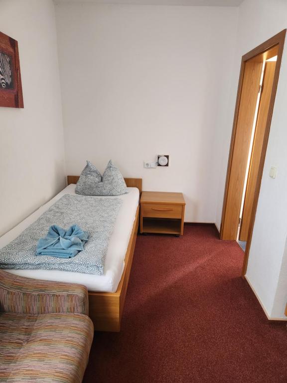 Postel nebo postele na pokoji v ubytování Mainstern Hotel
