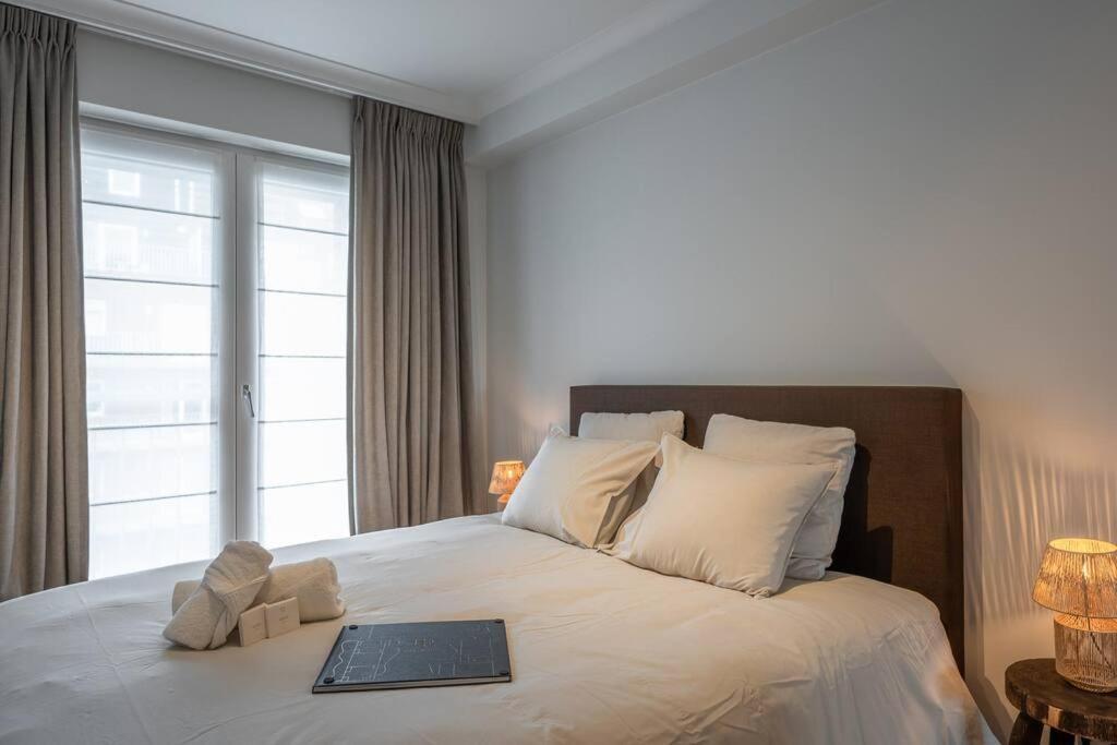 Postel nebo postele na pokoji v ubytování Morgenzon luxueus appartement