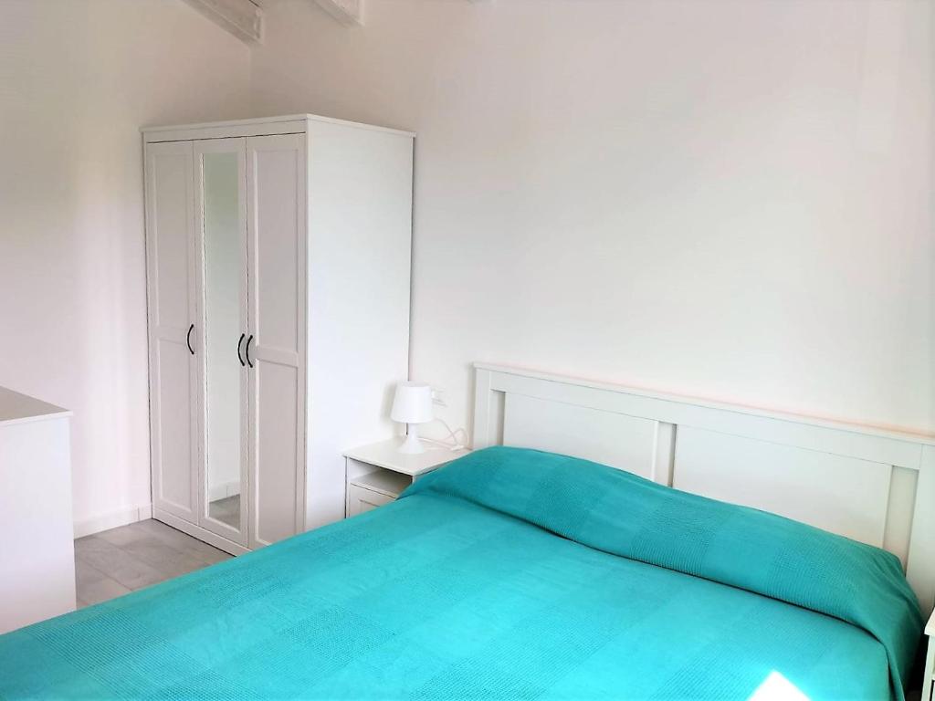 A bed or beds in a room at Affittimoderni Castelsardo La Gemma