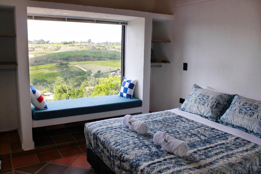 Postel nebo postele na pokoji v ubytování Mesa De los Santos, Balcones De los Santos Cabaña Lounge Eucalipto