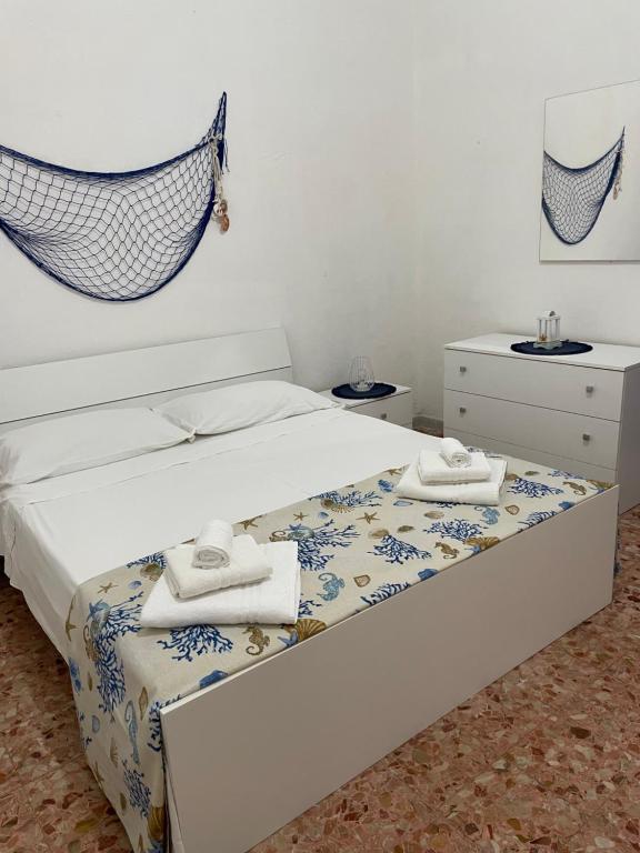 מיטה או מיטות בחדר ב-La Casa di Giusy