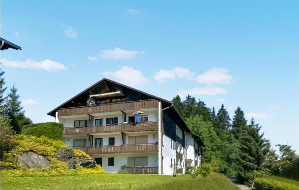 a large building with a gambrel roof at Nice Apartment In Oberreute With House A Mountain View in Oberreute