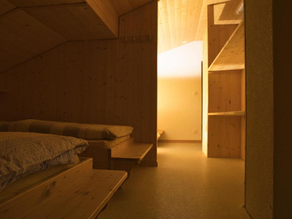 Postel nebo postele na pokoji v ubytování Hotel Aletschhorn