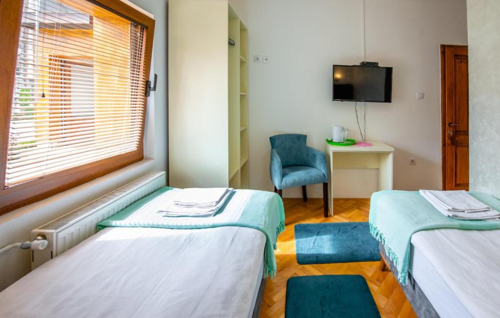 Postel nebo postele na pokoji v ubytování Guesthouse Sandra