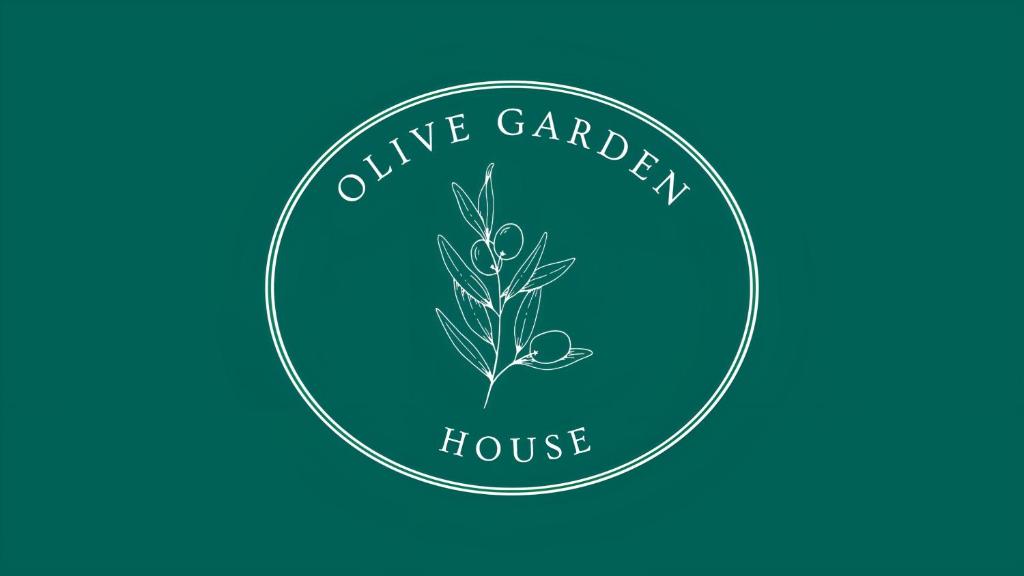 un logo pour la maison d'oliveraie dans l'établissement Olive Garden House 1, à Izola