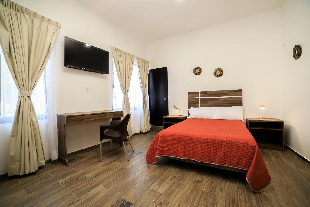 Katil atau katil-katil dalam bilik di Capital O Hotel Boutique Las Torres