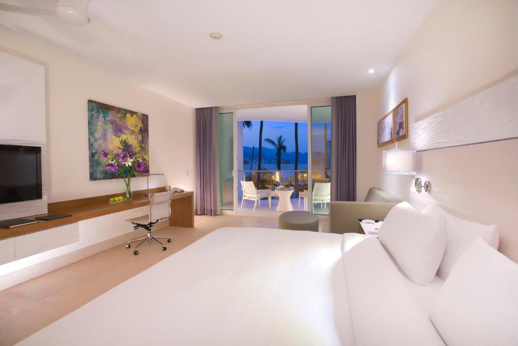 Postel nebo postele na pokoji v ubytování Krystal Grand Puerto Vallarta - All Inclusive