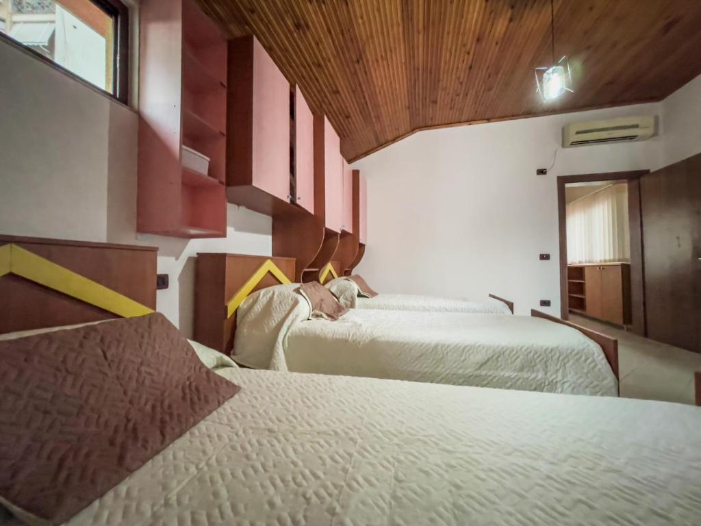 Postel nebo postele na pokoji v ubytování Vila Kodra
