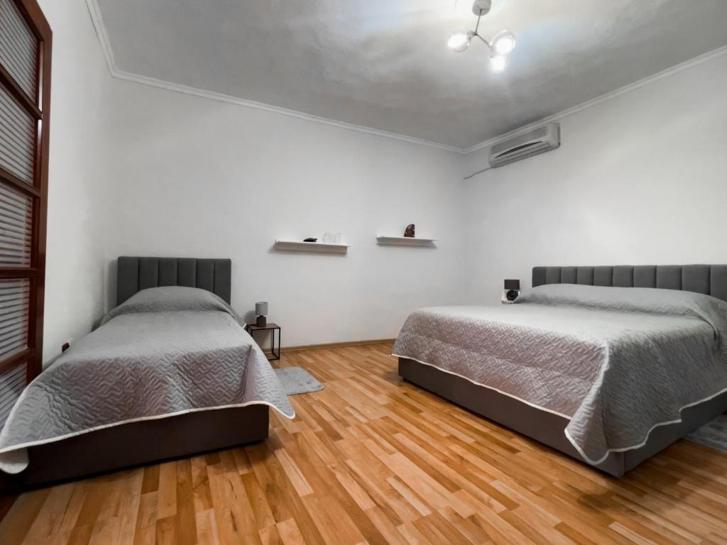 Postel nebo postele na pokoji v ubytování Vila Kodra