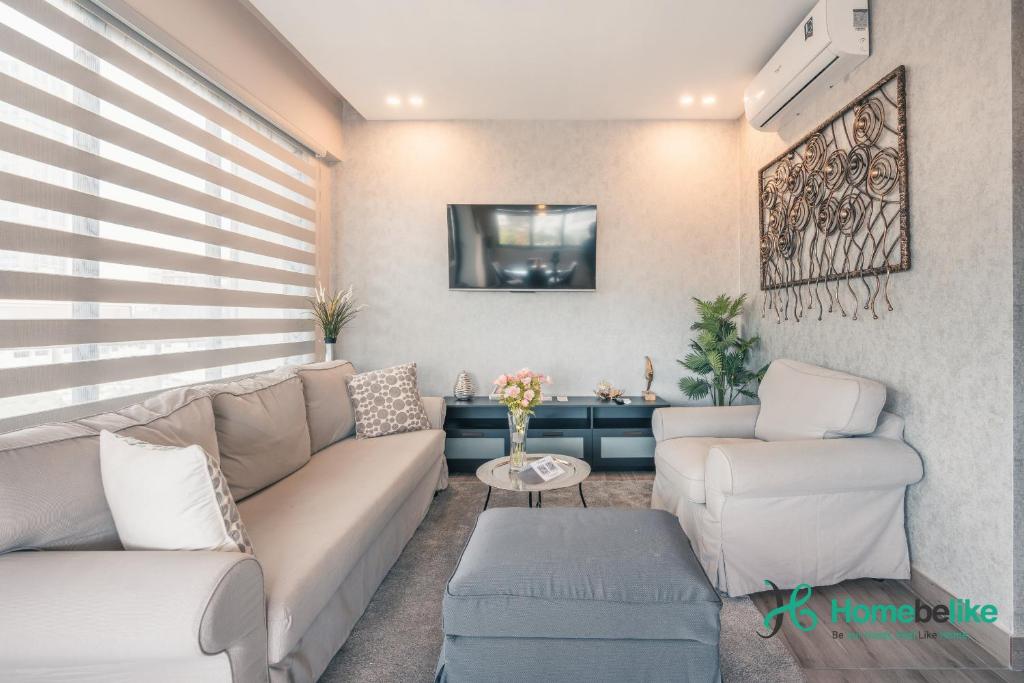a living room with a couch and two chairs at Regatta Living II with Breakfast Included! - 502 in Los Prados