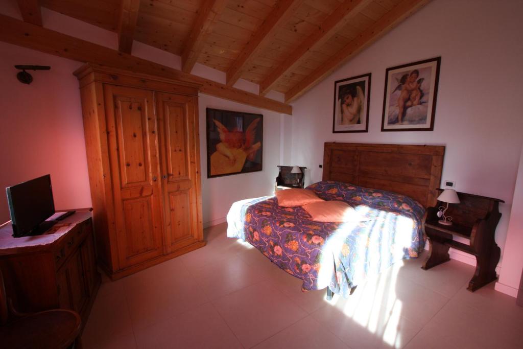 Postel nebo postele na pokoji v ubytování B&B Le tre chiavi