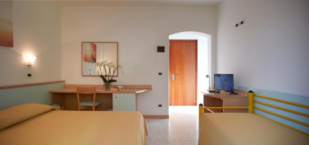 Postel nebo postele na pokoji v ubytování Hotel Pelikan