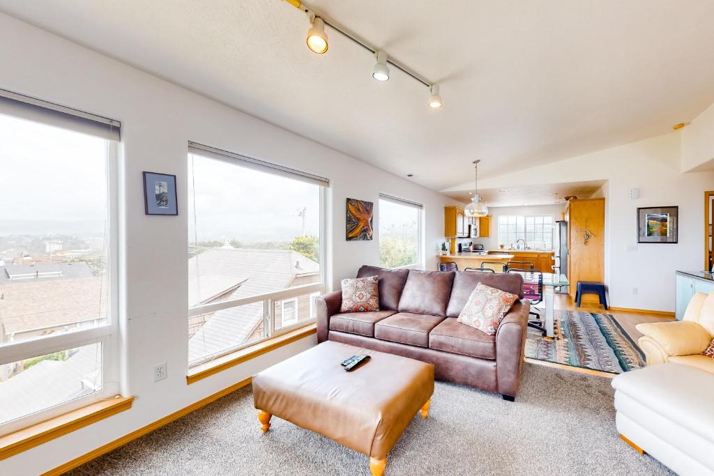 a living room with a couch and a table at JS Beach House in Lincoln City