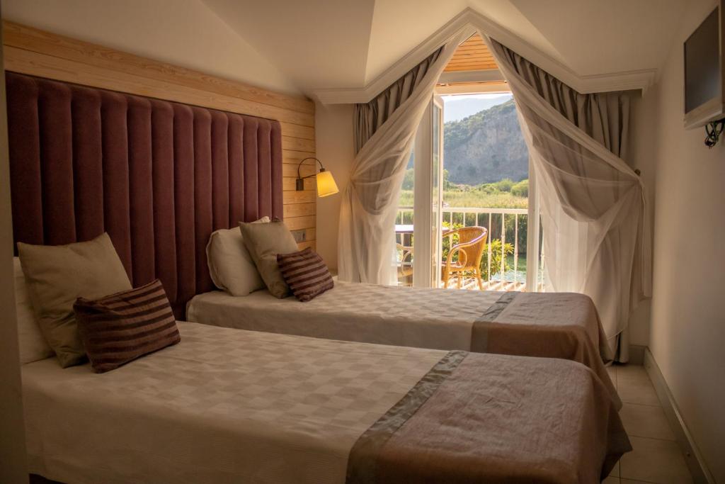 Postel nebo postele na pokoji v ubytování Aktaş Butik Hotel