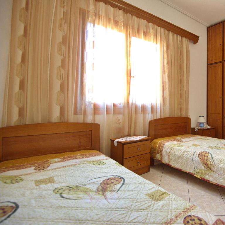 A bed or beds in a room at Magdas house
