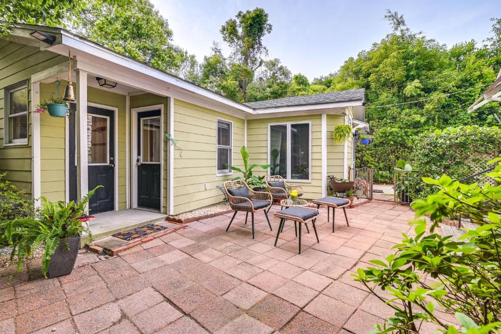 a patio with chairs and a table in front of a house at Cute Georgetown Villa Less Than 1 Mi to Historic District in Georgetown