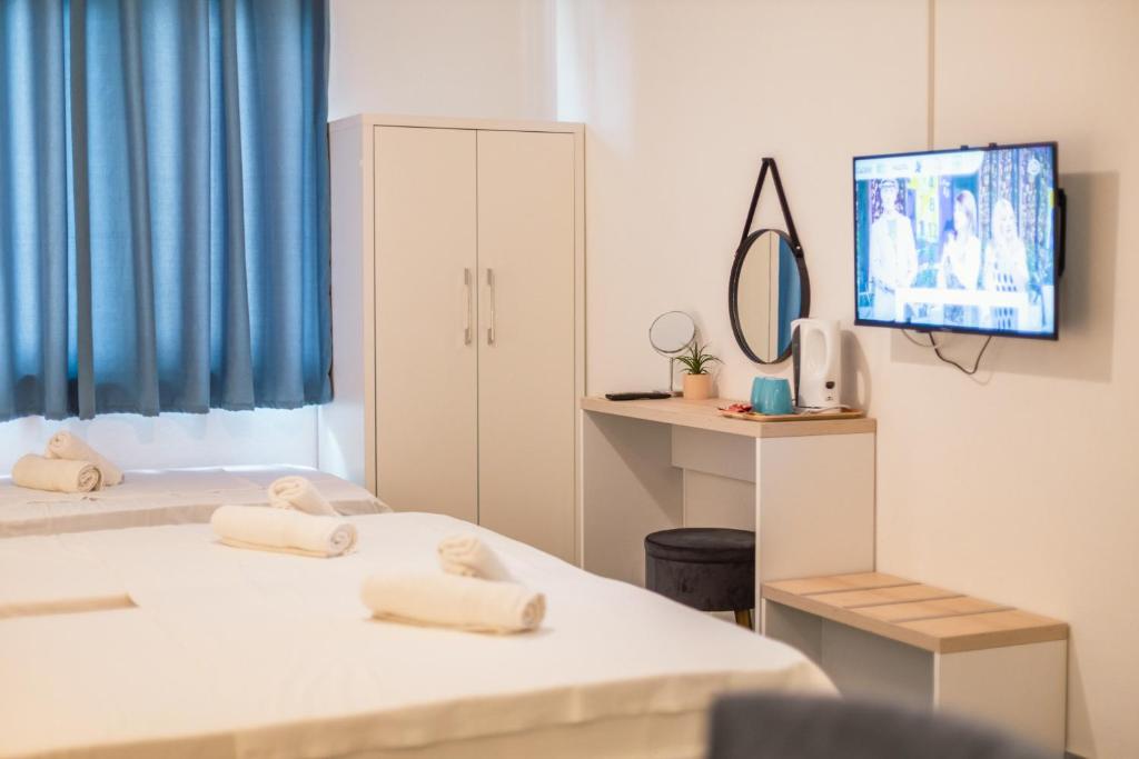 Una cama o camas en una habitación de Barba Rooms