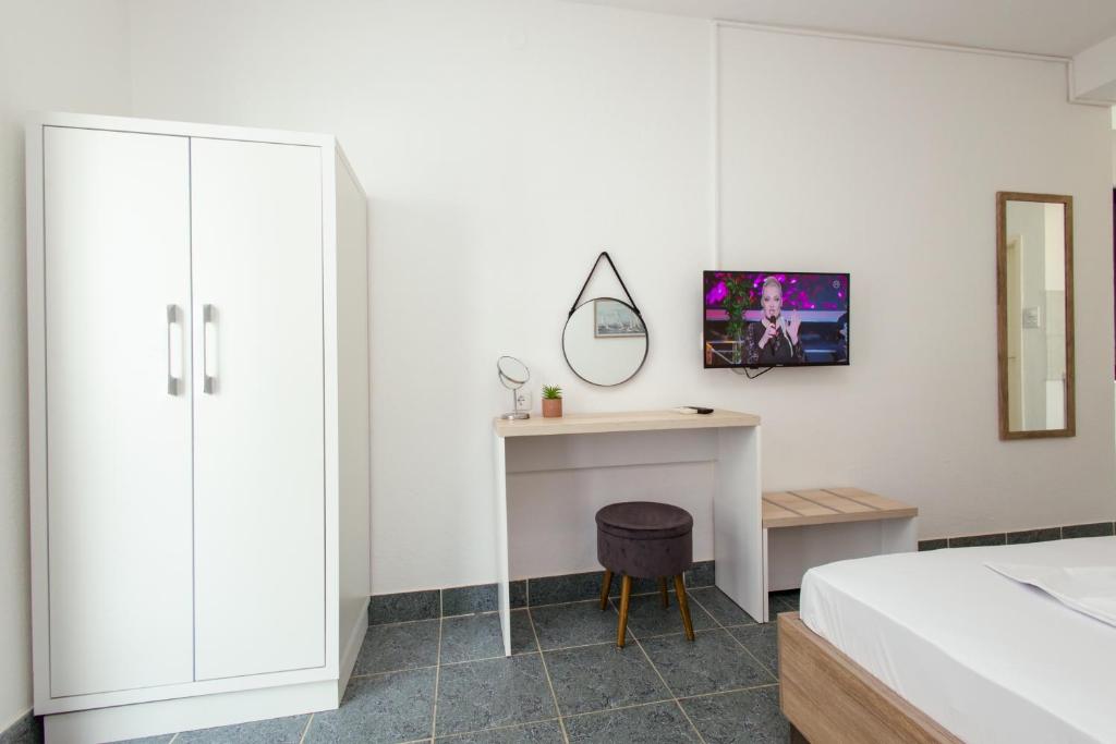 Una cama o camas en una habitación de Barba Rooms