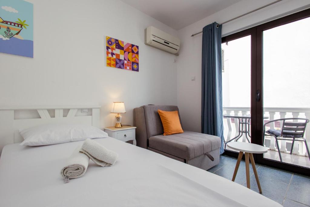 Una cama o camas en una habitación de Barba Rooms