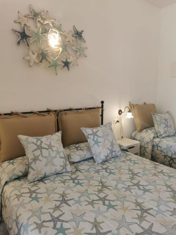 A bed or beds in a room at Hotel Rodà