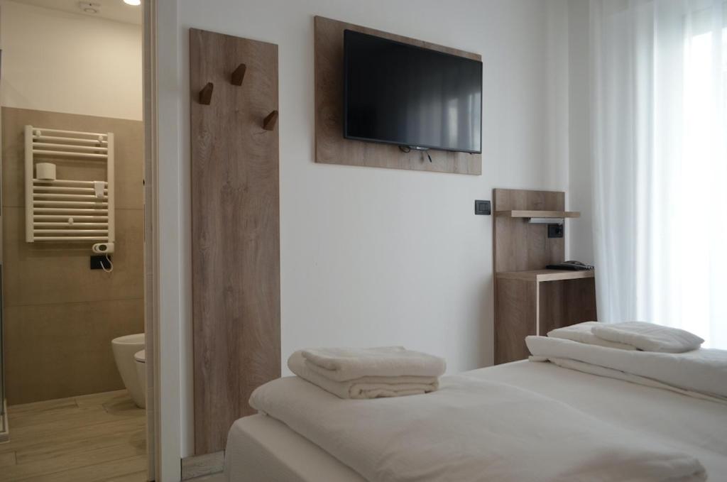Uma cama ou camas num quarto em Hotel Altinate