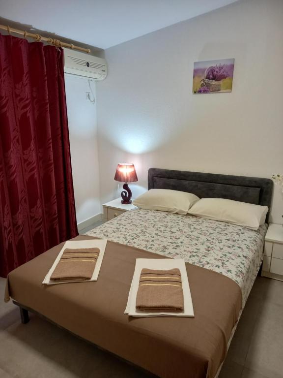 Postel nebo postele na pokoji v ubytování Bugenvilija