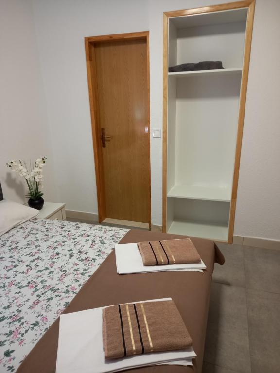 Postel nebo postele na pokoji v ubytování Bugenvilija